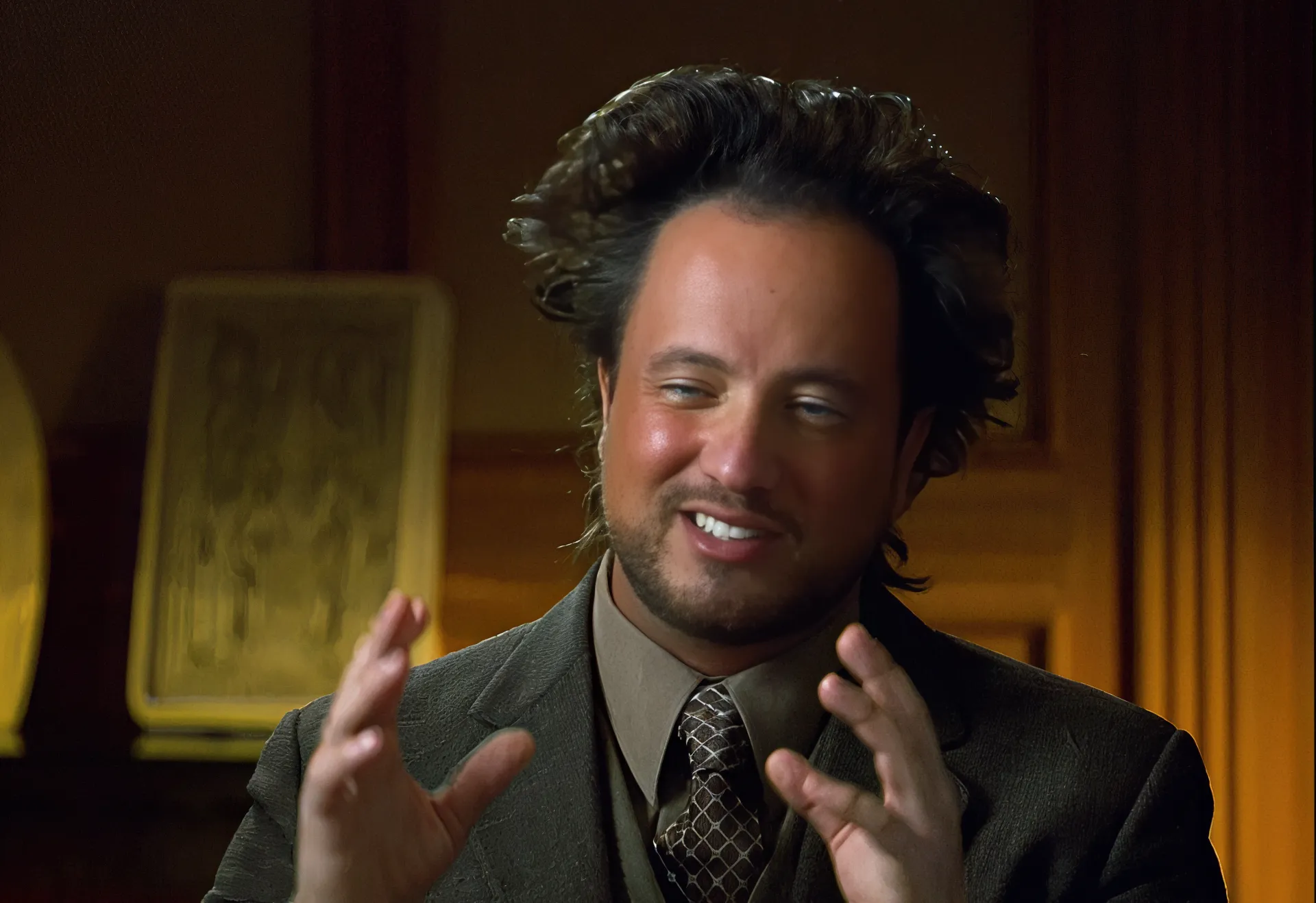 Man with wild hair gesturing, often used in 'Ancient Aliens' meme.