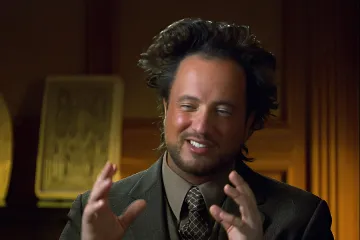 Man with wild hair gesturing, often used in 'Ancient Aliens' meme.