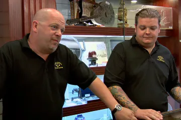 Two men in a pawn shop discussing a deal.