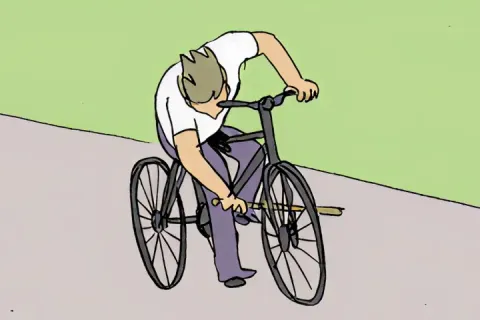 A person on a bike inserts a stick into the wheel and falls over.