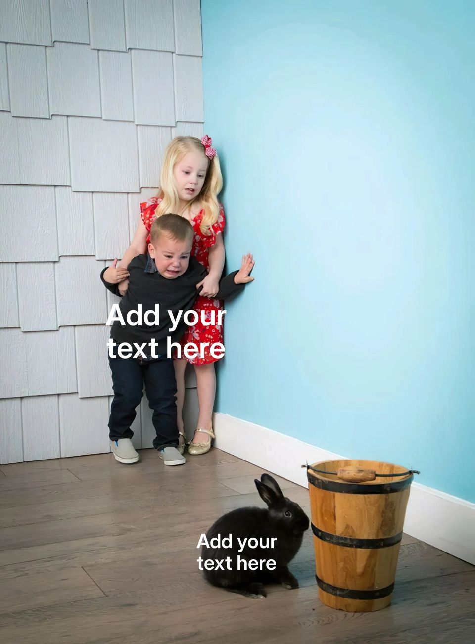 Two children looking scared of a small black rabbit near a wooden bucket.