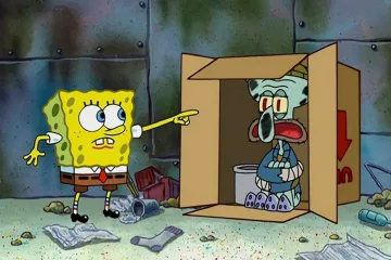 SpongeBob pointing at Squidward sitting in a cardboard box.