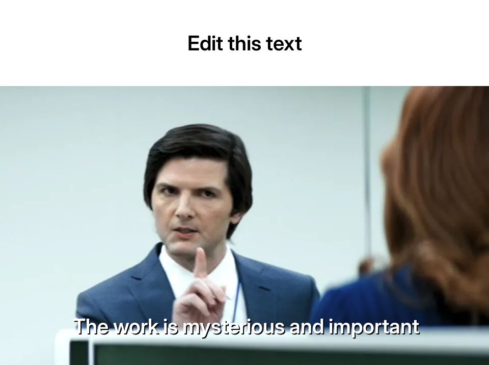 Man in a suit gesturing with finger, talking to a woman in an office setting.