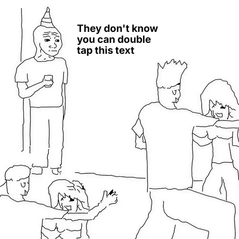 A person with a party hat standing alone at a party, holding a drink, while others dance.