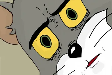 Close-up of Tom the cat with wide eyes and a surprised expression.